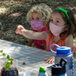 Two little girls at a table